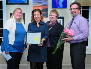 Photo caption: The Westhampton Free Library’s March Community Hero, Laura Fabrizio (second from left), was recognized by the library at a ceremony on March 14. She is pictured with (from left) Library Director Danielle Waskiewicz, program coordinator Nola Thacker and head of reference Jay Janoski. Photo courtesy of Michael Azzato