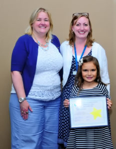 Pictured with September hero Arden Faloon  is Library Director Danielle Waskiewicz and Idea Place Librarian Marie Yervasi
