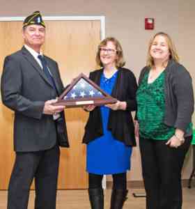 Navy veteran Michael Berdinka was honored as a Hometown Hero by the Westhampton Free Library at a ceremony on March 16. He is pictured with his wife, Susan (center) and Westhampton Free Library Director Danielle Waskiewicz (right).