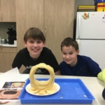 These pictures show the tweens while working on their pringle rings and with their completed pringle rings.